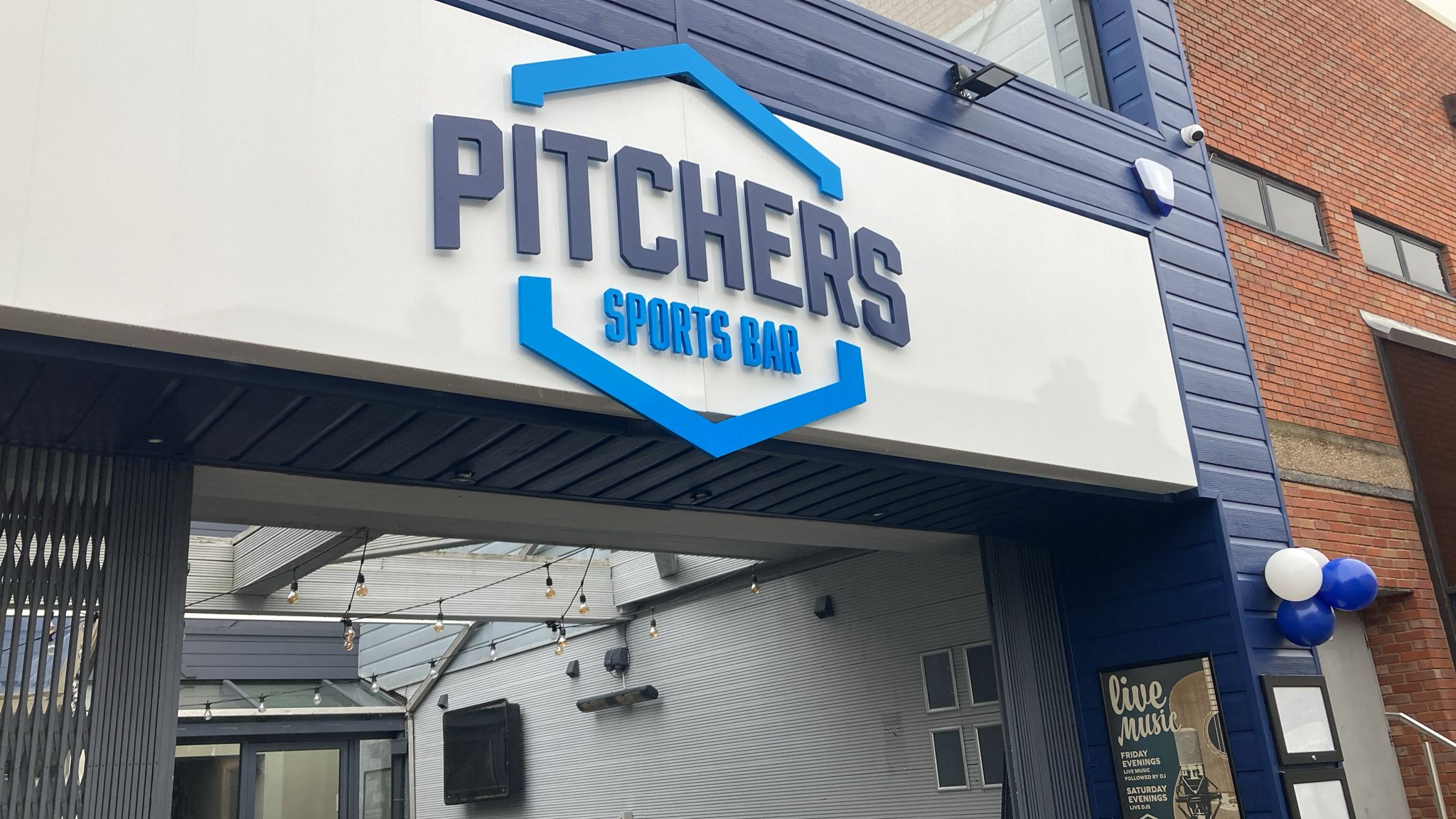 photo of the outside pub sign in blue and white