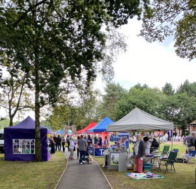 Tamworth Castle grounds with stalls and marquees on a sunny day