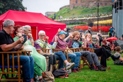 Public enjoying event on upper lawn at Tamworth Castle Grounds Staffordshire 